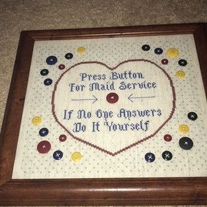 Cross-stitched art- press button for maid service